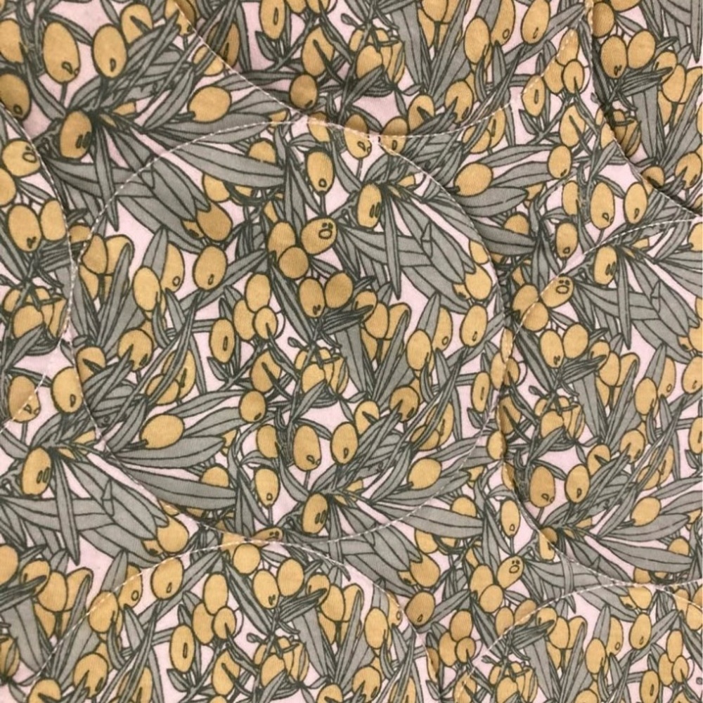 Kate Quinn olive print organic cotton quilt